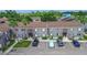 An aerial view of condominiums displaying parking, landscaping, and the building's architectural design at 3805 Cortez Cir # B, Tampa, FL 33614