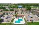 Overhead view of condo complex with pool, parking, and landscaping at 3805 Cortez Cir # B, Tampa, FL 33614