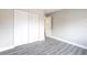 Bedroom with neutral walls, wood-look floors, closet, and a large window at 3805 Cortez Cir # B, Tampa, FL 33614
