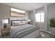 Cozy bedroom featuring a neutral color palette, window with curtains, and nature-inspired artwork at 3805 Cortez Cir # B, Tampa, FL 33614