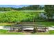 A small bridge over landscaped foliage leading to a pond at 3805 Cortez Cir # B, Tampa, FL 33614