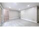 Bright living room with recessed lighting, neutral paint, and sliding glass door leading to outdoor space at 3805 Cortez Cir # B, Tampa, FL 33614
