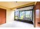 Screened-in patio with concrete flooring offering an outdoor view and separate door access at 3805 Cortez Cir # B, Tampa, FL 33614