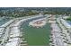 Aerial view showcases the waterfront community with a large canal and many boat docks at 384 Boca Ciega Point Blvd, St Petersburg, FL 33708
