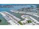 Aerial view of community highlighting its waterfront location, private docks, and access to open waters at 384 Boca Ciega Point Blvd, St Petersburg, FL 33708