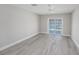 Bright room with wooden flooring and a glass sliding door leading to an outdoor waterfront view at 384 Boca Ciega Point Blvd, St Petersburg, FL 33708