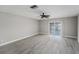Bright bedroom with modern flooring and a sliding glass door with waterfront views at 384 Boca Ciega Point Blvd, St Petersburg, FL 33708