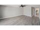Bright bedroom featuring modern flooring, a ceiling fan, and neutral wall paint at 384 Boca Ciega Point Blvd, St Petersburg, FL 33708