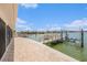 Waterfront view of the wood dock and boat lift situated on the canal at 384 Boca Ciega Point Blvd, St Petersburg, FL 33708
