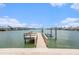Stunning waterfront property featuring a private boat dock and lift, perfect for the avid boater at 384 Boca Ciega Point Blvd, St Petersburg, FL 33708