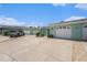 Exterior shot of home showcasing the front yard, driveway, and attached garage at 384 Boca Ciega Point Blvd, St Petersburg, FL 33708