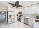 Beautiful kitchen with stainless steel appliances, white cabinets, and water views at 384 Boca Ciega Point Blvd, St Petersburg, FL 33708