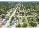 Wide aerial view of the neighborhood showcasing the street, and neighboring homes at 4435 1St S Ave, St Petersburg, FL 33711