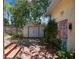 Backyard shed and vibrant flowers add charm to the outdoor space at 4435 1St S Ave, St Petersburg, FL 33711
