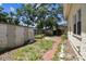 Backyard with lush greenery and a shed for extra storage at 4435 1St S Ave, St Petersburg, FL 33711