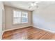 Bedroom with hardwood floors and a decorative stained glass window at 4435 1St S Ave, St Petersburg, FL 33711