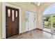 Inviting entryway featuring decorative tiling and an arched window that provides ample natural light to the space at 4435 1St S Ave, St Petersburg, FL 33711
