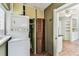 Functional laundry room with washer, dryer, and convenient access to the kitchen at 4435 1St S Ave, St Petersburg, FL 33711