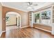 Living room with built-in shelving, hardwood floors, and bright natural light, creating a cozy and inviting space at 4435 1St S Ave, St Petersburg, FL 33711