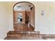 View of spacious and bright living room with hardwood floors, open archway, and access to other rooms at 4435 1St S Ave, St Petersburg, FL 33711