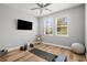 Bright exercise room featuring hardwood floors, plenty of natural light, and exercise equipment at 4465 Tubular Run, Land O Lakes, FL 34638