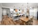 Open-concept kitchen with a large island, modern appliances, and a dining area for Gathering gatherings at 4465 Tubular Run, Land O Lakes, FL 34638