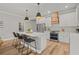 Bright, stylish kitchen with a large island, pendant lighting, and stainless steel appliances at 4465 Tubular Run, Land O Lakes, FL 34638