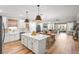 Bright and airy kitchen featuring an island, modern appliances, and a seamless transition to the living area at 4465 Tubular Run, Land O Lakes, FL 34638