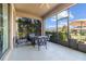 Cozy screened in lanai featuring a seating area for outdoor relaxation and entertaining with a view of the backyard at 4465 Tubular Run, Land O Lakes, FL 34638
