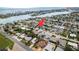 Bird's eye view of a charming coastal community highlighting waterfront homes surrounded by lush, mature landscaping at 463 85Th Ave, St Pete Beach, FL 33706
