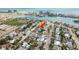 Aerial view of a neighborhood near the coast with waterways and easy beach access at 463 85Th Ave, St Pete Beach, FL 33706
