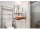 Bright bathroom with wood countertop, modern vanity, and glass enclosed shower at 5128 Billings Dr, Holiday, FL 34690