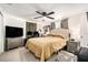 Spacious bedroom with ceiling fan, neutral walls, tile floors and ample closet space at 5128 Billings Dr, Holiday, FL 34690