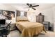 Comfortable bedroom featuring a ceiling fan, neutral walls, tile floors and ample closet space at 5128 Billings Dr, Holiday, FL 34690
