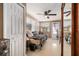 Cozy bedroom featuring a ceiling fan, tile floors, and natural light through the large window at 5128 Billings Dr, Holiday, FL 34690