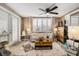 Bright living room featuring tile floors, comfortable seating arrangements, and neutral paint at 5128 Billings Dr, Holiday, FL 34690