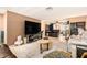 Open-concept living room featuring tile flooring, neutral walls, and ample space for entertaining at 5128 Billings Dr, Holiday, FL 34690