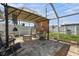 Back patio with covered awning and open yard at 5128 Billings Dr, Holiday, FL 34690