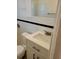 Bright bathroom featuring updated vanity and classic white tiling with black accent at 5627 Commonwealth N Ave, St Petersburg, FL 33703