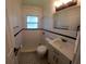 Updated bathroom featuring black and white tile, a modern vanity, and stylish fixtures at 5627 Commonwealth N Ave, St Petersburg, FL 33703