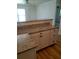 Stylish kitchen counter featuring granite countertops, modern cabinetry, and wood-look flooring at 5627 Commonwealth N Ave, St Petersburg, FL 33703