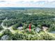 Expansive aerial view showing the home's position amid lush greenery, trees, and sprawling landscape at 5927 Flatwoods Manor Cir, Lithia, FL 33547
