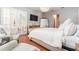 Bright and airy bedroom with hardwood floors, a chandelier, and plantation shutters at 5927 Flatwoods Manor Cir, Lithia, FL 33547