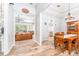 Cozy dining room with hardwood floors that connect to the open floor plan and living room at 5927 Flatwoods Manor Cir, Lithia, FL 33547