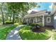 Charming home with a curved walkway, beautiful lawn, and inviting front porch at 5927 Flatwoods Manor Cir, Lithia, FL 33547