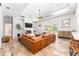Bright living room featuring fireplace, modern furnishings, and views of the backyard at 5927 Flatwoods Manor Cir, Lithia, FL 33547
