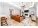Inviting living room with a fireplace, wood flooring, and stylish furnishings at 5927 Flatwoods Manor Cir, Lithia, FL 33547