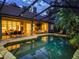 The backyard has a screened pool, dining and outdoor living spaces at 5927 Flatwoods Manor Cir, Lithia, FL 33547