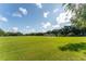 Expansive grassy soccer field with nets, set against a backdrop of trees and blue skies at 5927 Flatwoods Manor Cir, Lithia, FL 33547