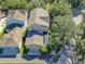 Aerial view of a single-Gathering home with a screened-in pool, surrounded by lush landscaping at 6207 Bleeker St, Riverview, FL 33578